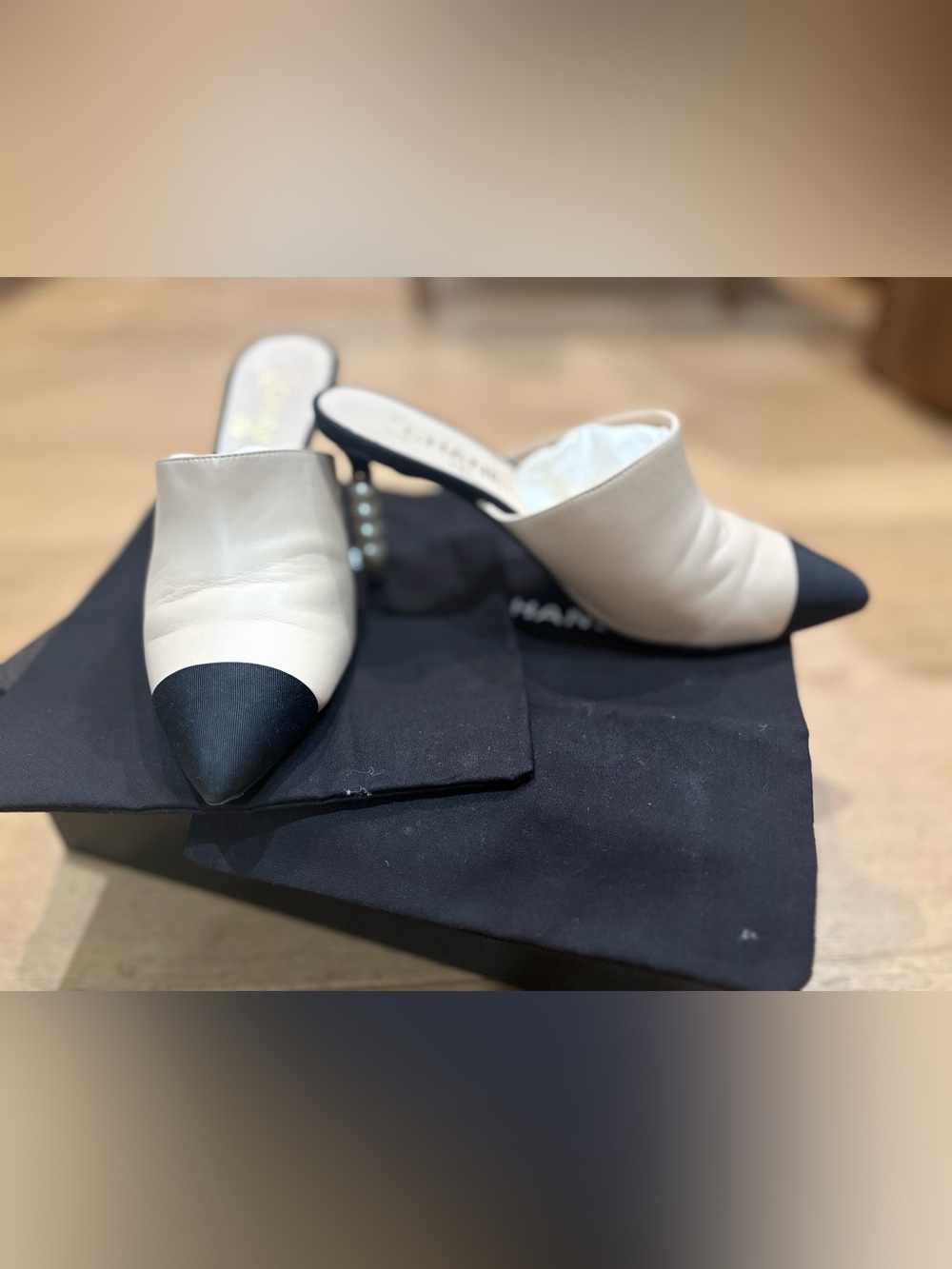 CHANEL Two-Tone Leather Mules with Pearl-Embellished Heel in White & Black